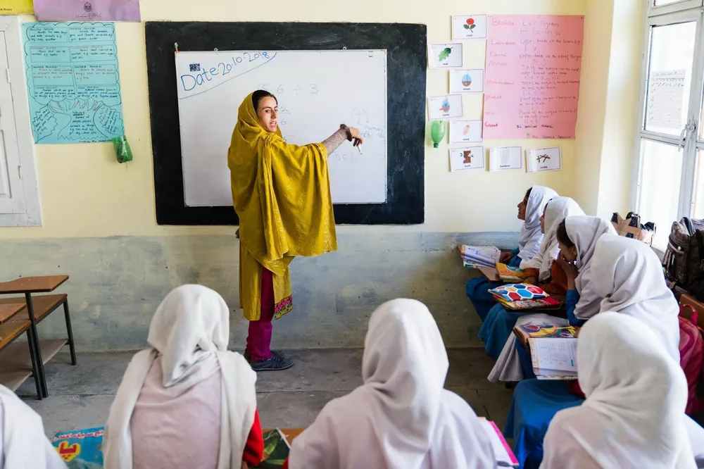 Teacher instructing students in a classroom